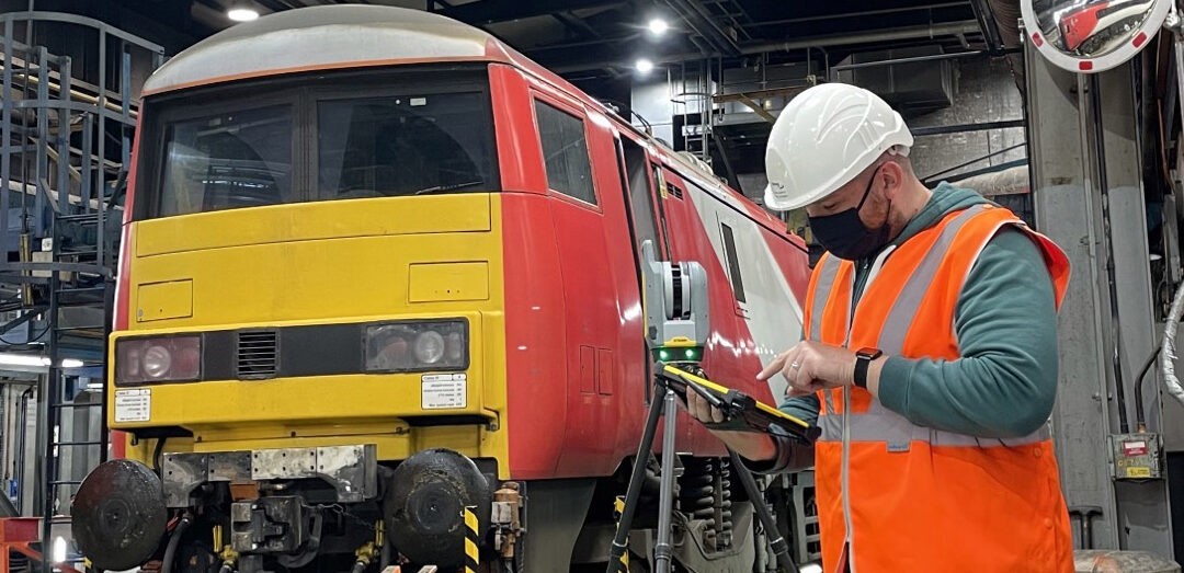 Emeg design services team using e-scan laser scanning equipment in a rail depot